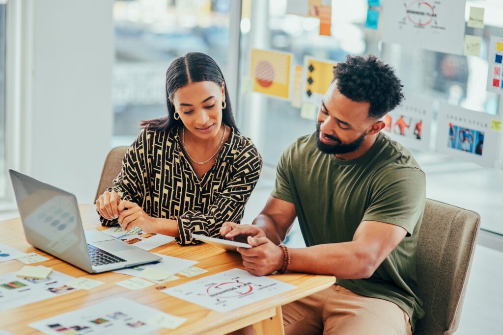 Two people gathering, investigating and summarising LinkedIn frequency data.