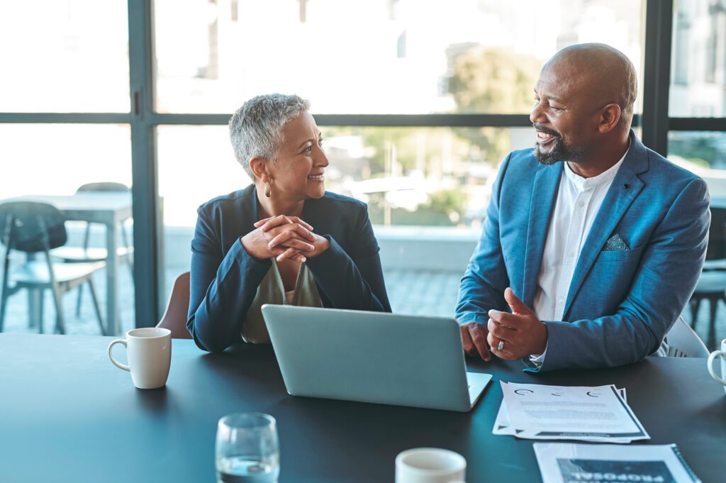 CEO and senior manager discussing LinkedIn conversation ads.